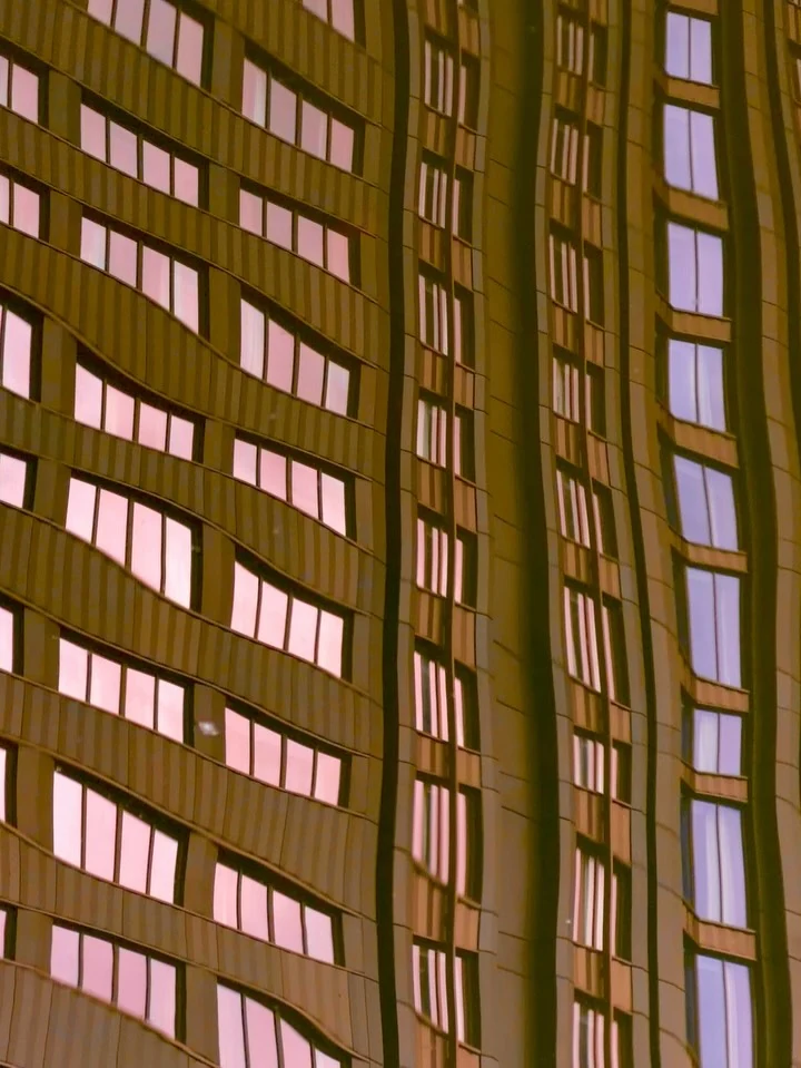 Rows of windows on a warm-toned facade