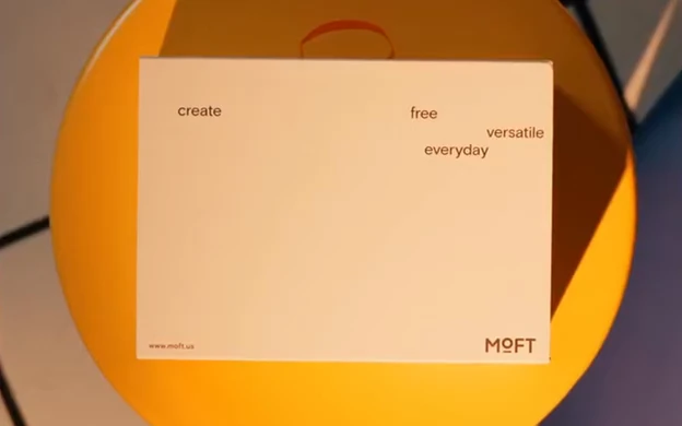 MOFT packaging on a geometric surface under warm and violet light