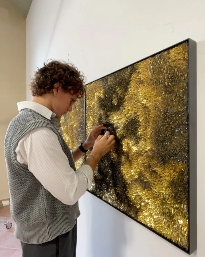 Mattia filming a textured artwork at MAR
