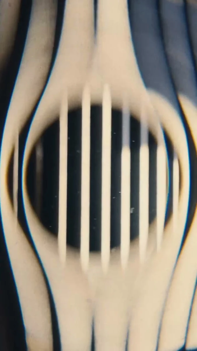 A striped object distorted through the Warp filter