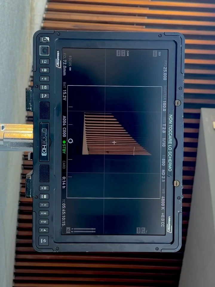 The camera monitor showing a staircase composition