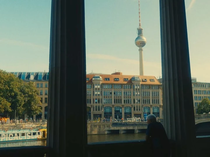 Berlin’s television tower seen through a window