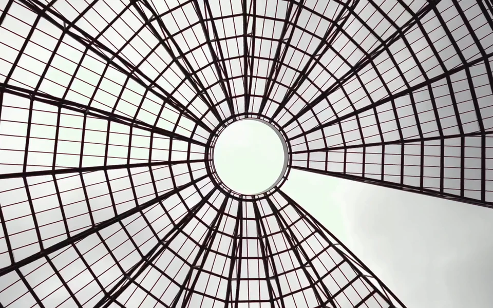 The radial glass roof at MART converging on a bright circular opening