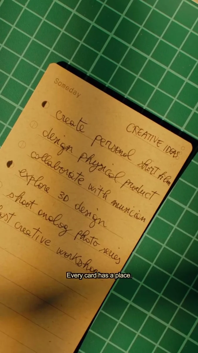 A handwritten daily plan on a green cutting mat